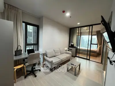 Modern living room with study area and city view, featuring sleek furniture and natural light.