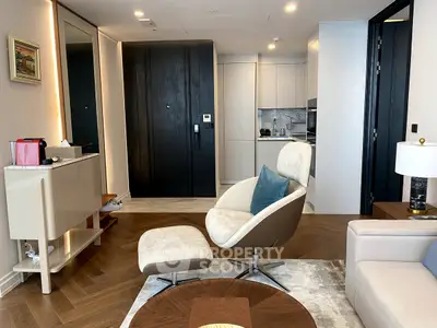 Modern living room with stylish furniture and open kitchen layout in a luxury apartment.