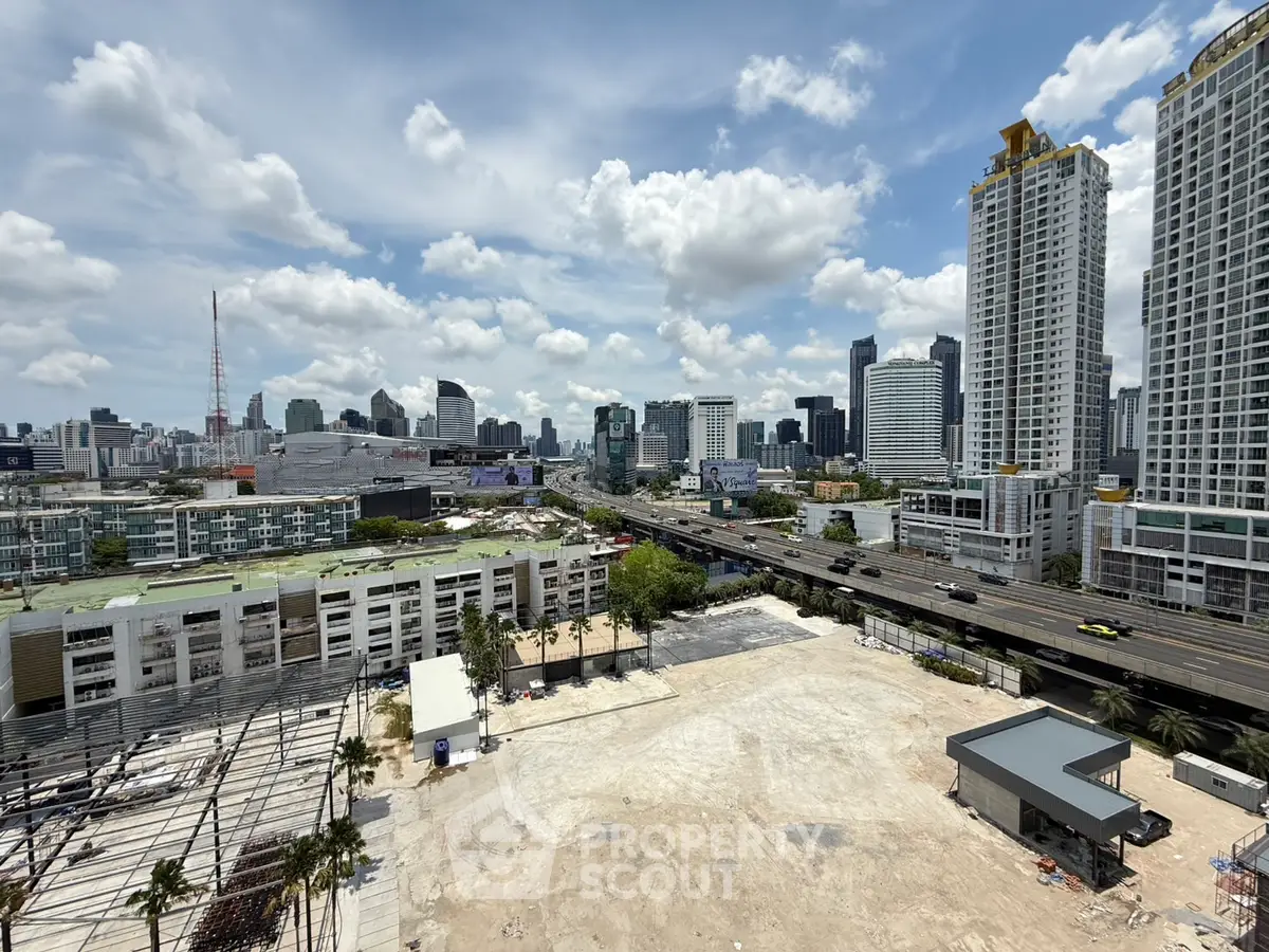 Stunning cityscape view with modern high-rise buildings and clear blue sky.