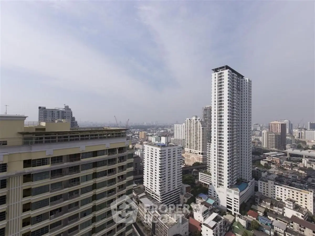 Stunning cityscape view with high-rise buildings under a clear sky, perfect for urban living enthusiasts.