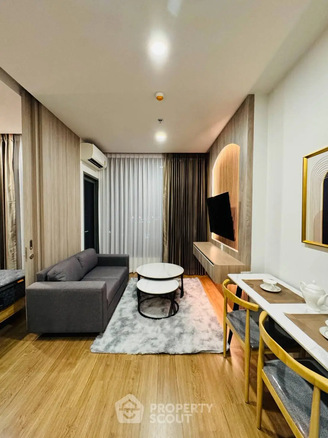 Modern living room with stylish decor and cozy seating area in a contemporary apartment.