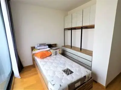 Cozy bedroom with modern wardrobe and natural light