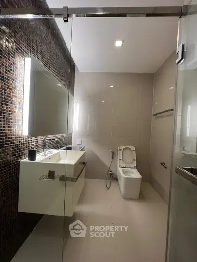 Modern bathroom with sleek design and glass shower door