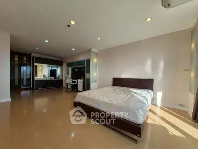 Spacious bedroom with modern design and ample natural light