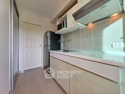 Modern kitchen with sleek cabinets and stainless steel appliances