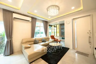 Luxurious living room with elegant chandelier and modern furniture