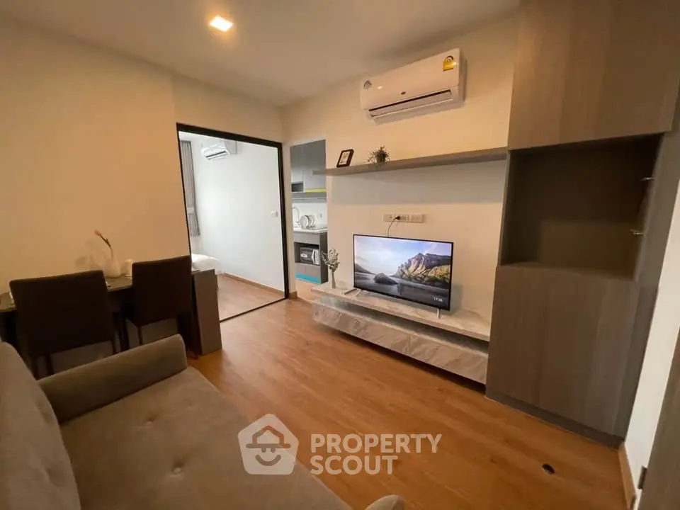 Modern living room with sleek furniture and built-in TV unit