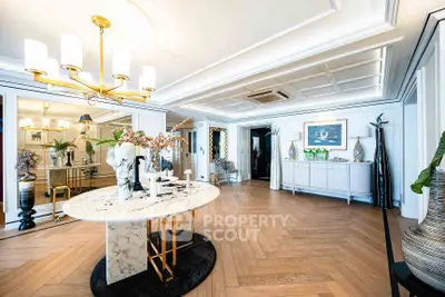 Luxurious living room with elegant decor and marble table in upscale apartment