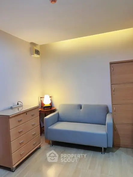 Cozy living room with modern sofa and wooden furniture