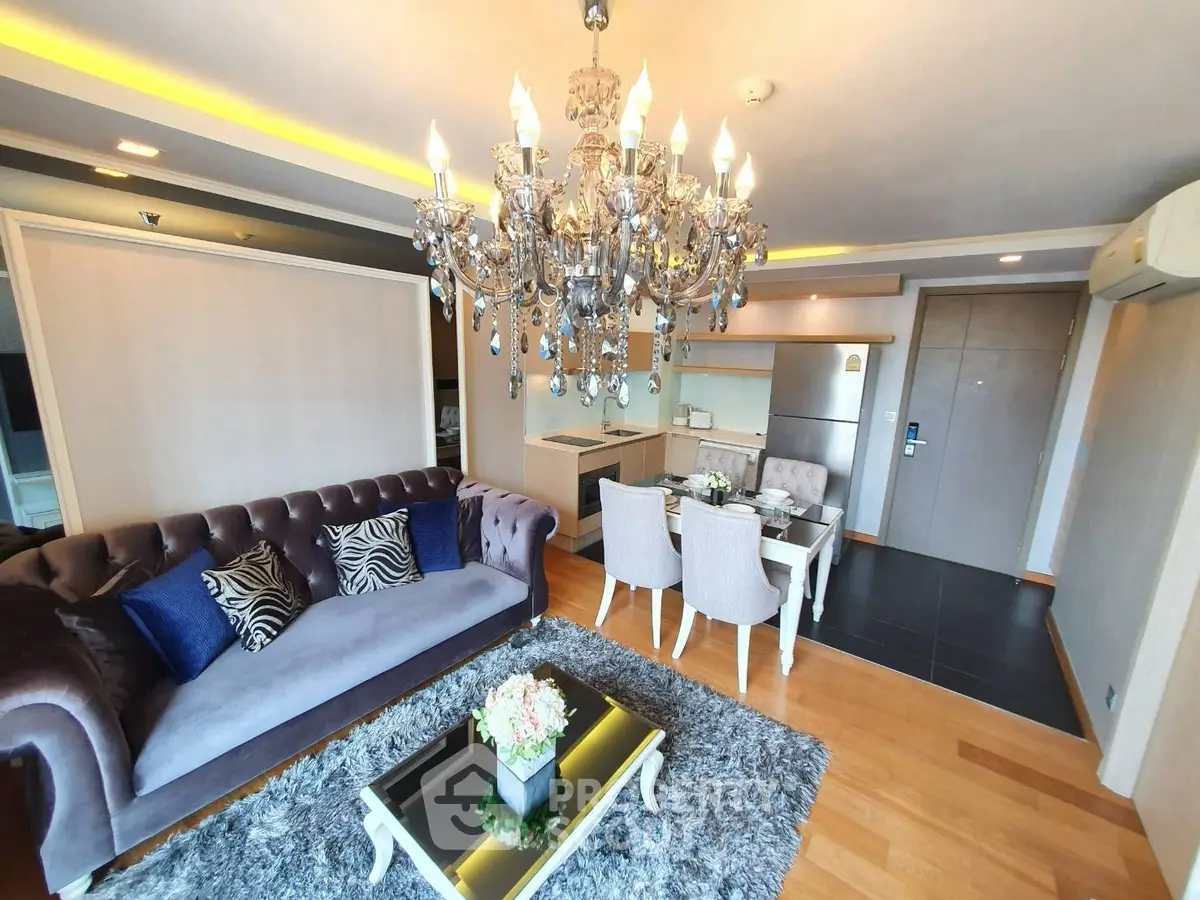 Luxurious living room with elegant chandelier and modern decor in upscale apartment