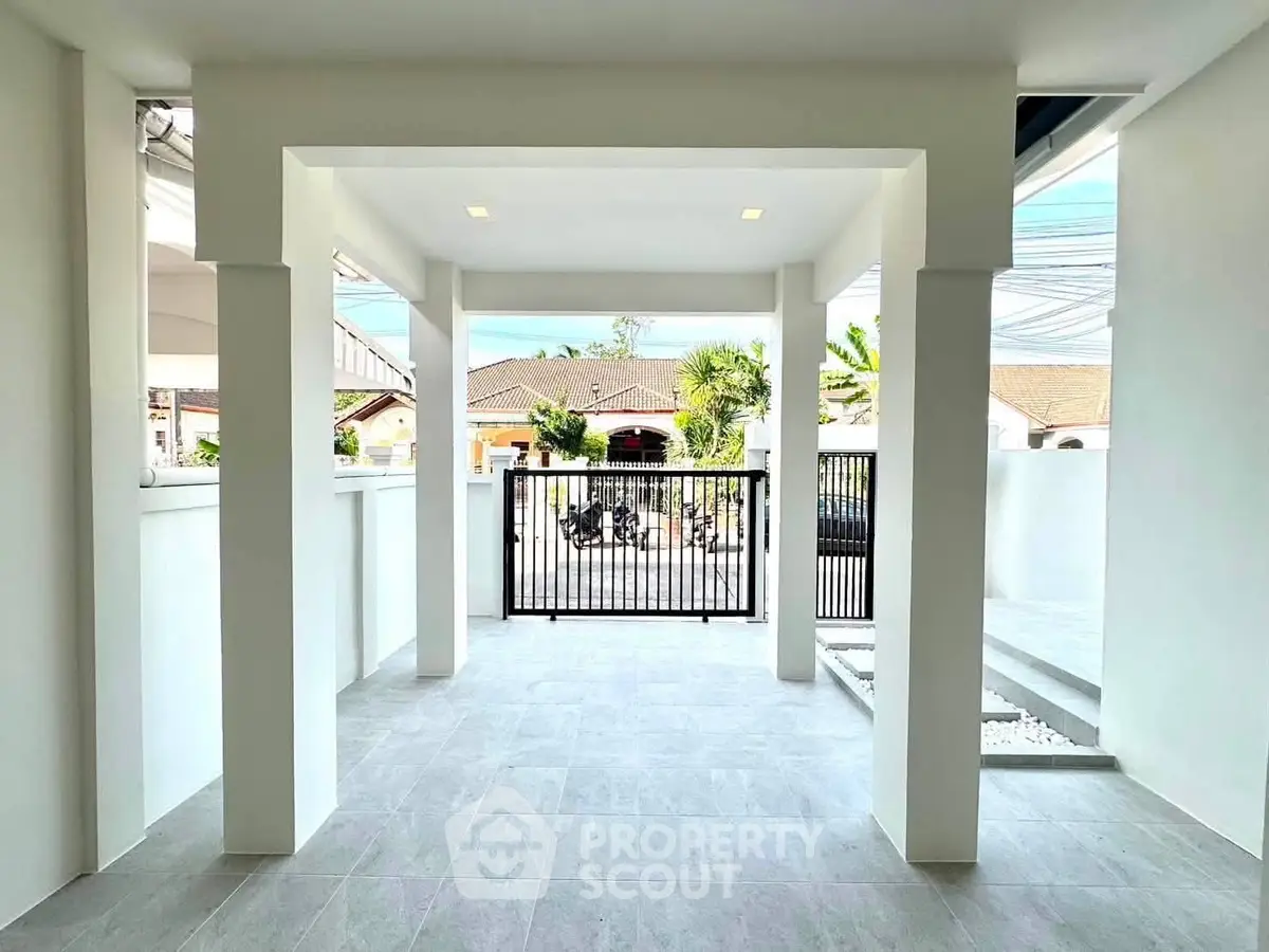 Spacious modern entrance with sleek design and open view, perfect for welcoming guests.