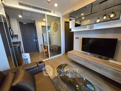 Modern living room with sleek furniture and stylish decor in a contemporary apartment.