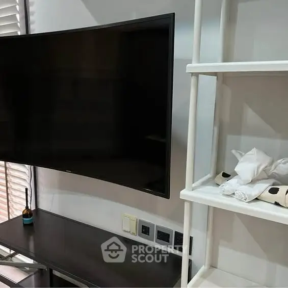 Modern living room with sleek TV and stylish shelving unit