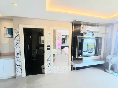 Modern living room with marble accents and built-in entertainment center
