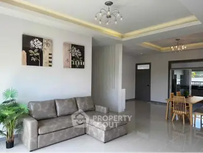 Spacious modern living room with elegant decor and ample natural light