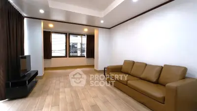 Spacious living room with modern decor and natural light