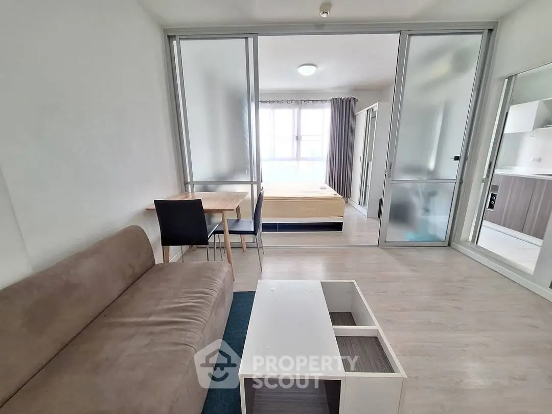 Modern studio apartment with open layout and sleek furnishings