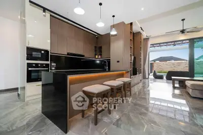 Luxurious modern kitchen with sleek design and open layout, featuring high-end appliances and stylish lighting.
