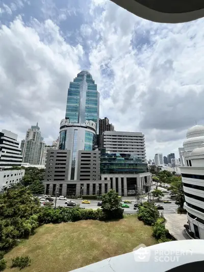 Stunning cityscape view featuring modern skyscrapers and lush greenery, perfect for urban living enthusiasts.