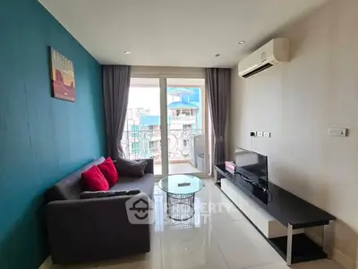 Modern living room with balcony, sleek furniture, and air conditioning in urban apartment.