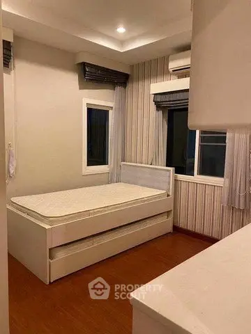 Cozy bedroom with modern design and wooden flooring