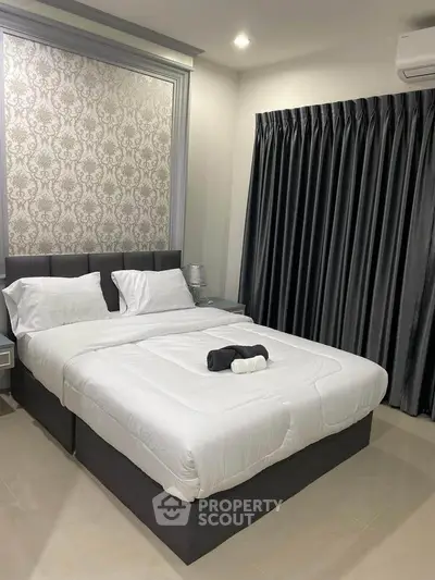 Luxurious bedroom with elegant decor and plush bedding