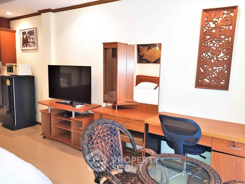 Spacious studio apartment with modern furniture and elegant decor