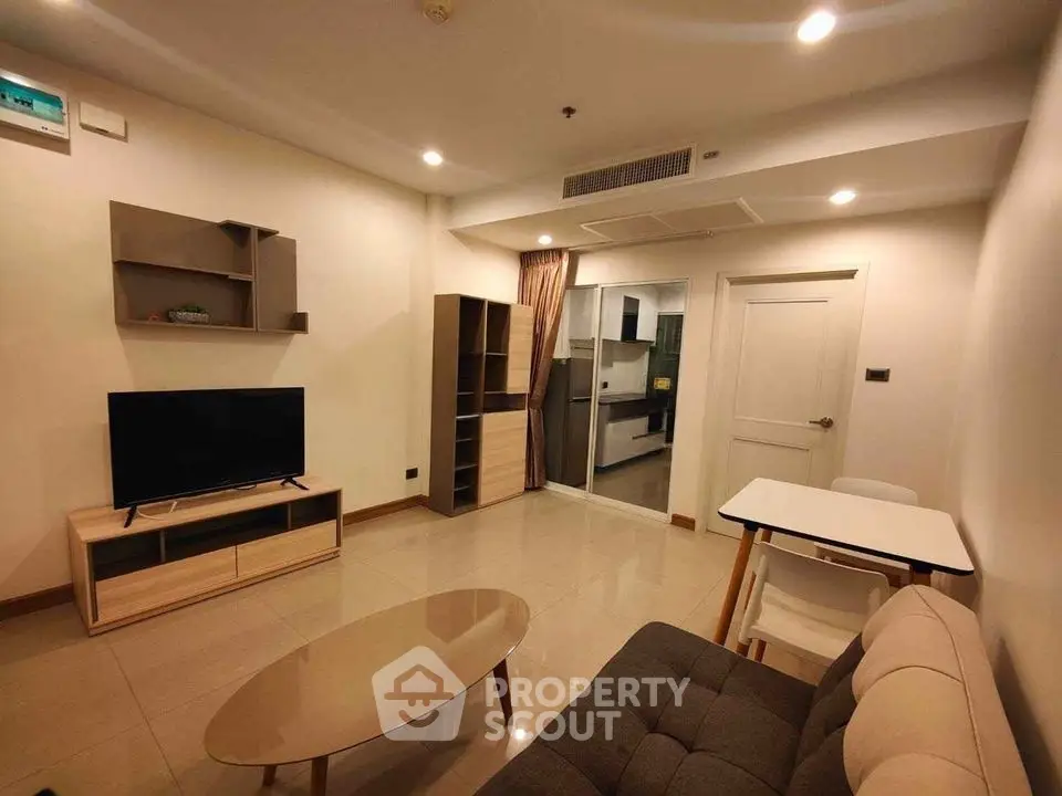 Modern living room with sleek furniture and open layout, perfect for urban living.