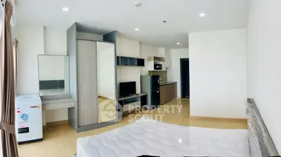 Modern studio apartment with open layout and stylish furnishings