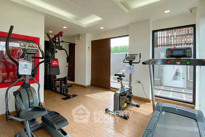 Modern gym with state-of-the-art fitness equipment and natural light