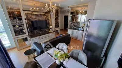Luxurious living room with elegant decor and modern kitchen in open layout