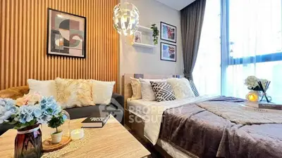 Cozy bedroom with modern decor, plush bedding, and stylish lighting