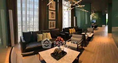 Luxurious modern living room with elegant decor and large windows offering stunning city views.