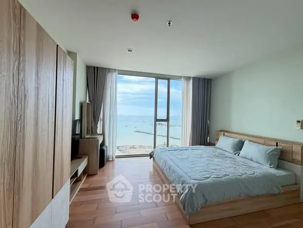 Stunning bedroom with ocean view in modern apartment