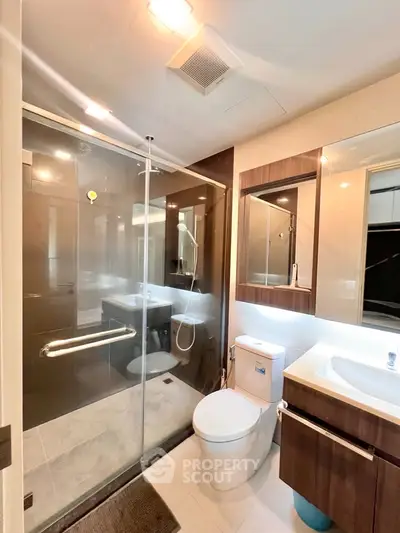 Modern bathroom with glass shower and sleek fixtures
