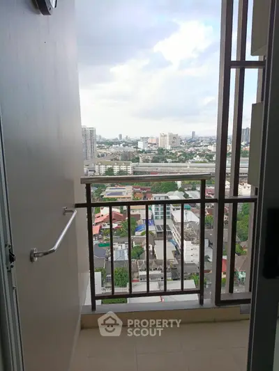 Stunning city view from a high-rise balcony, perfect for urban living.