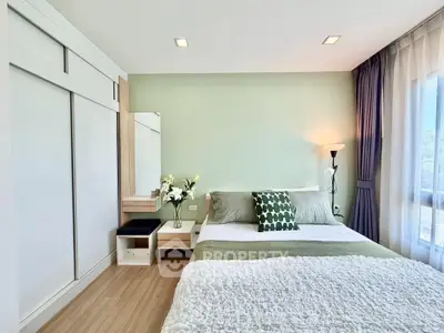 Modern bedroom with stylish decor and ample natural light