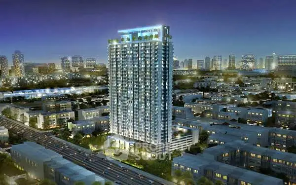 Stunning high-rise building with city skyline view at night, perfect for urban living.