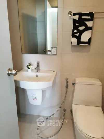 Modern bathroom with sleek fixtures and stylish decor in a contemporary home.