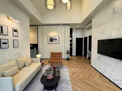 Modern living room with stylish decor and high ceiling