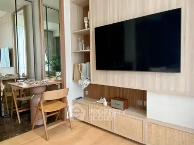 Modern living room with sleek TV setup and stylish dining area