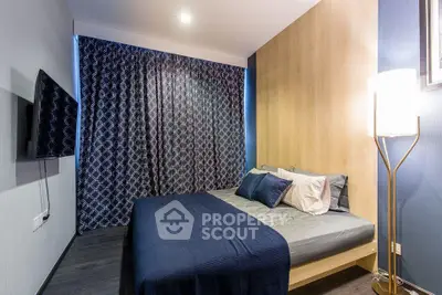 Modern bedroom with stylish decor, cozy bedding, and ambient lighting for a comfortable living experience.