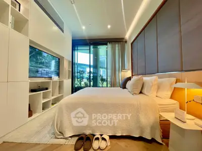 Luxurious modern bedroom with elegant decor and large windows offering natural light.