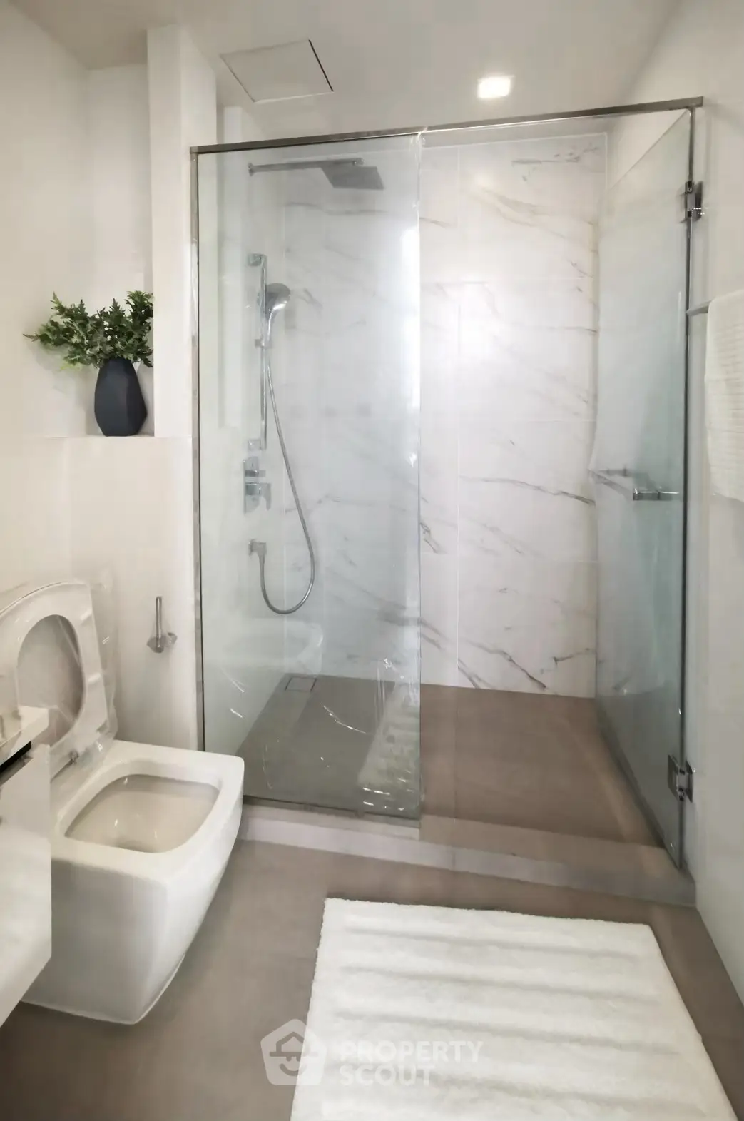 Modern bathroom with glass shower and sleek fixtures