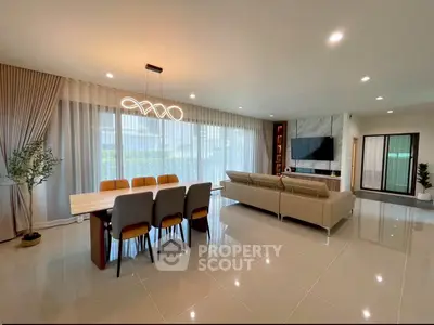 Spacious modern living room with elegant dining area and stylish lighting