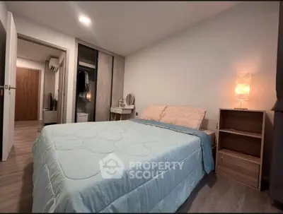 Cozy bedroom with modern decor and soft lighting, perfect for relaxation.