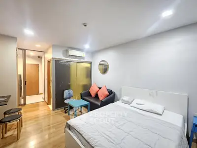 Modern studio apartment with cozy living area and stylish decor
