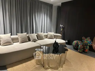 Luxurious modern living room with stylish sofa and unique coffee table, perfect for elegant gatherings.