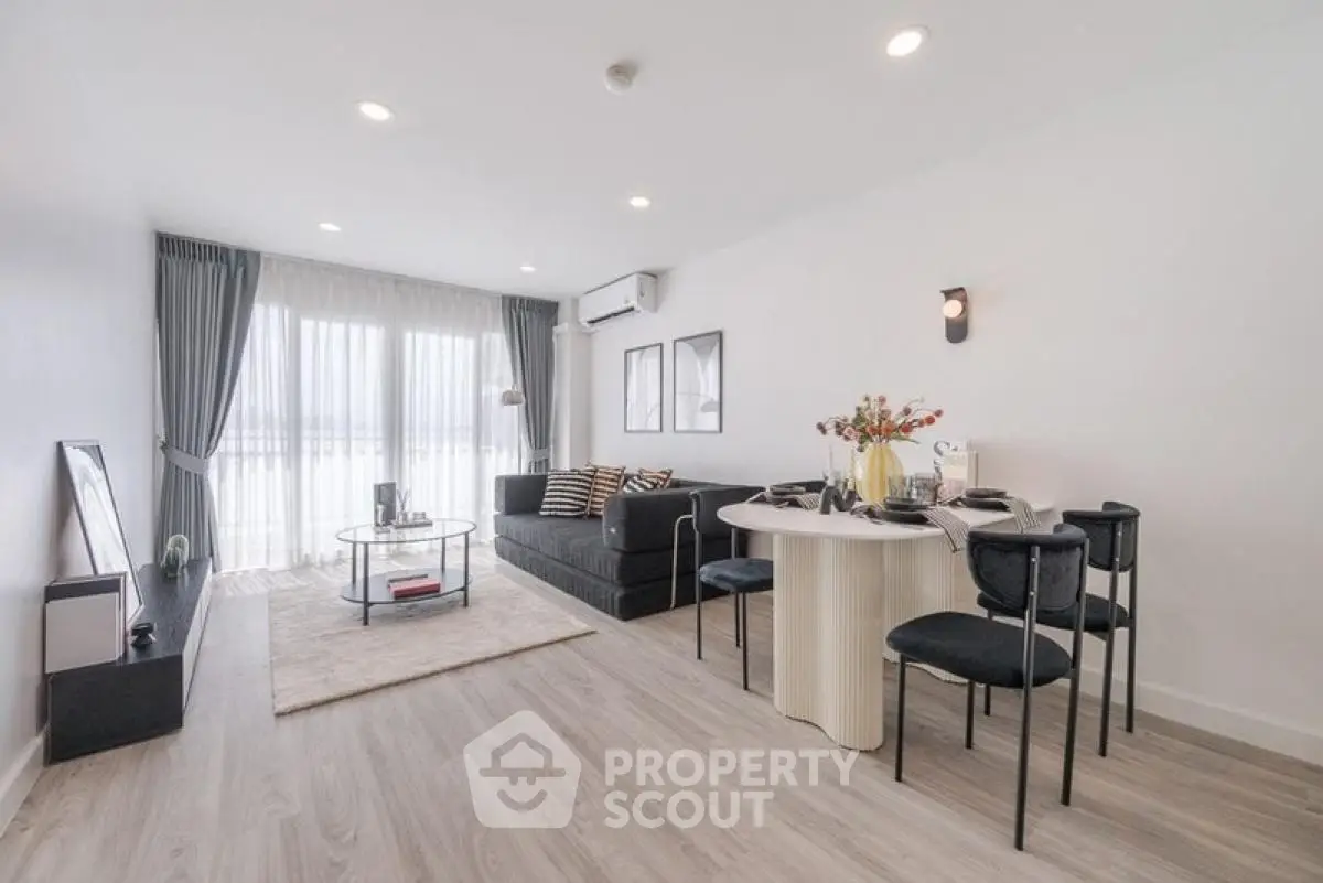 Spacious modern living room with elegant decor and natural light