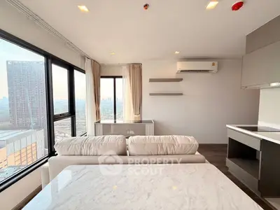 Modern living room with panoramic city view and sleek interior design.